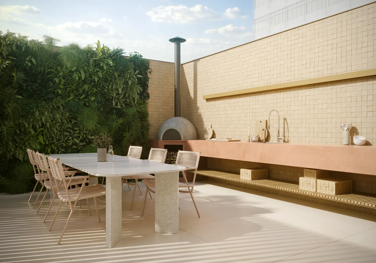 Terraço gourmet com mesa comprida, parede verde e forno