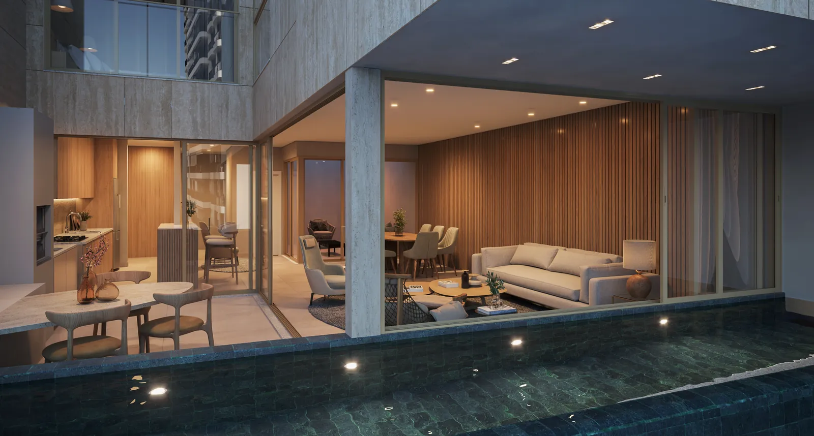 Sala de uma townhouse aberta para a piscina privativa, à noite