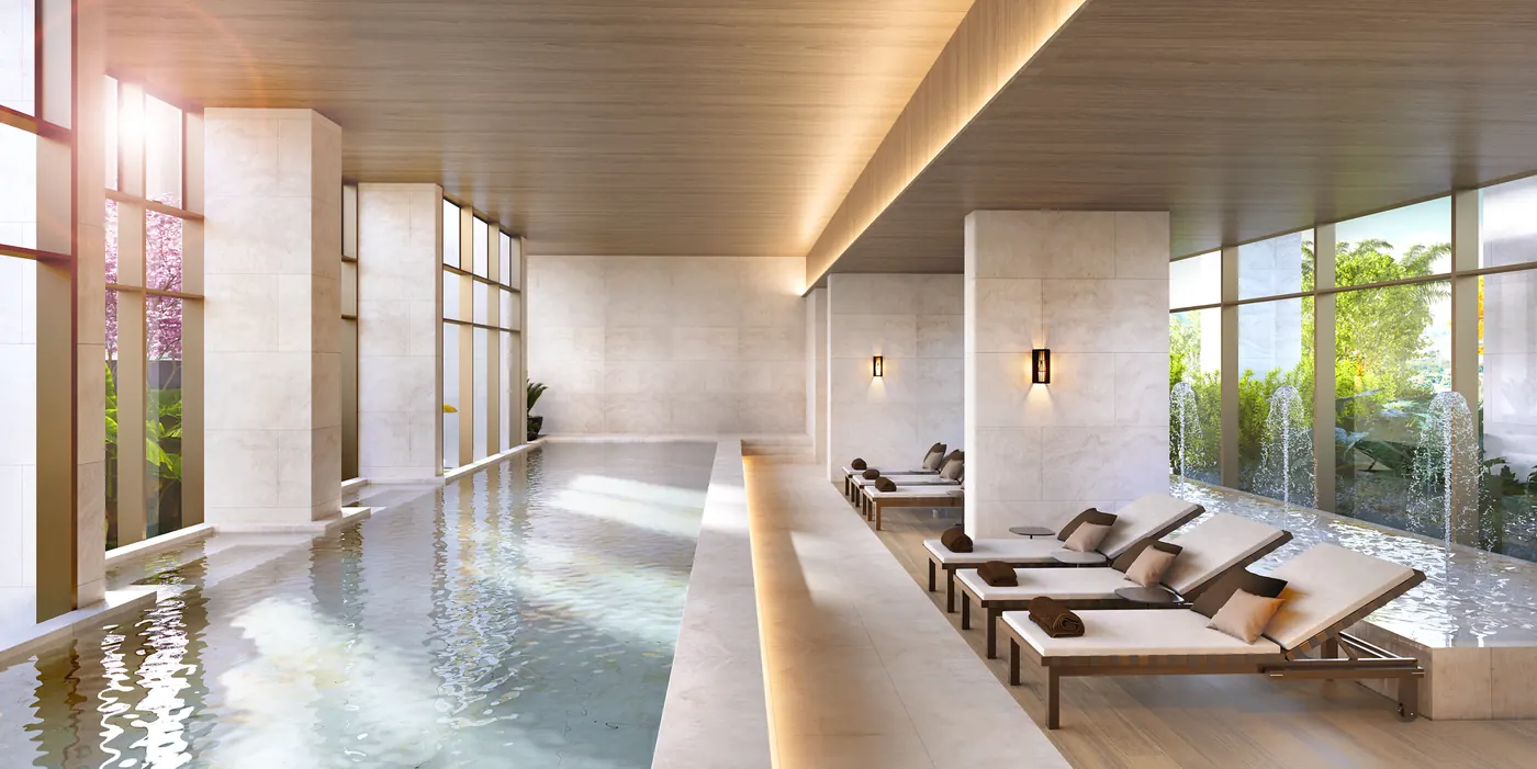 Piscina coberta climatizada com raia e espreguiçadeiras