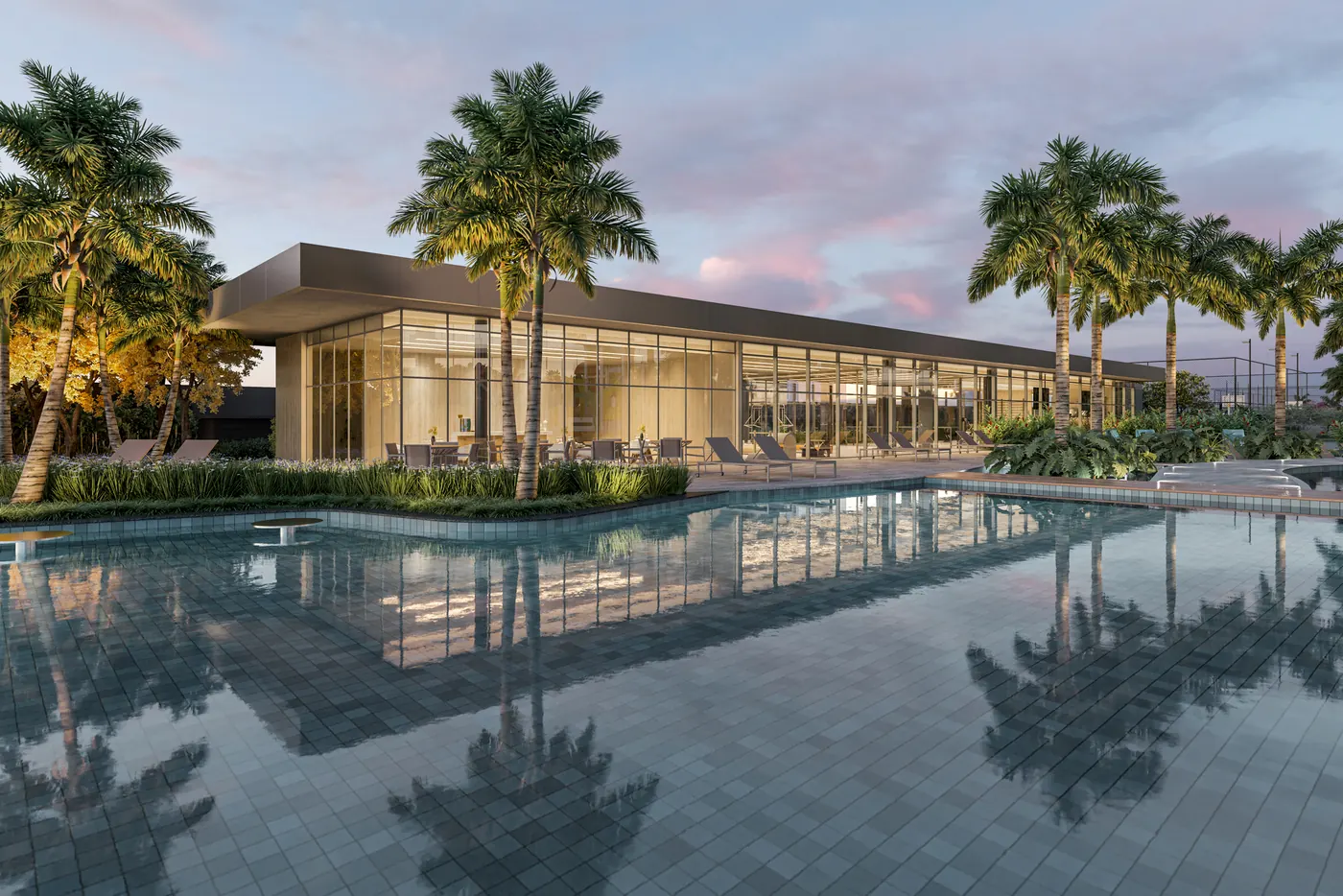 Pool bar entre coqueiros, com a piscina refletindo o céu no fim da tarde