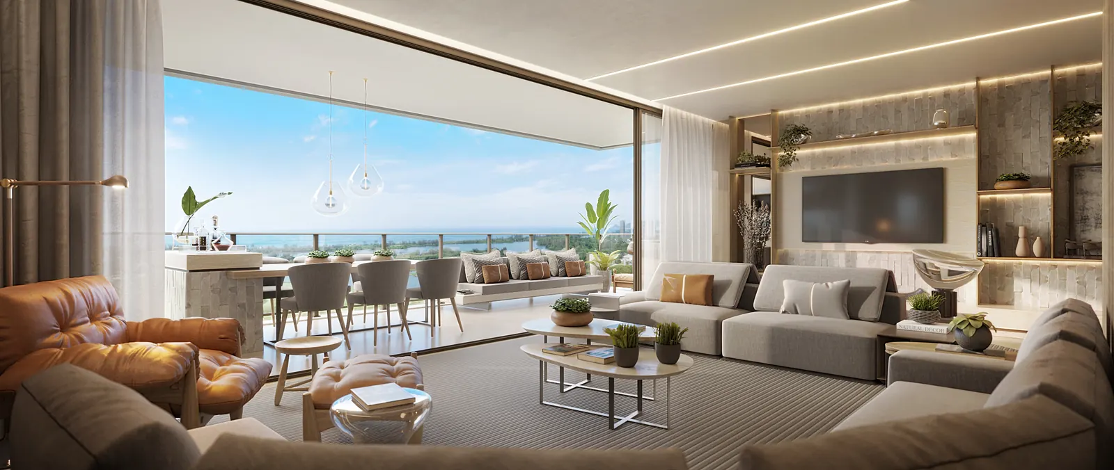 Perspectiva da sala do Atlântico 3.000, integrada à varanda com vista para o mar
