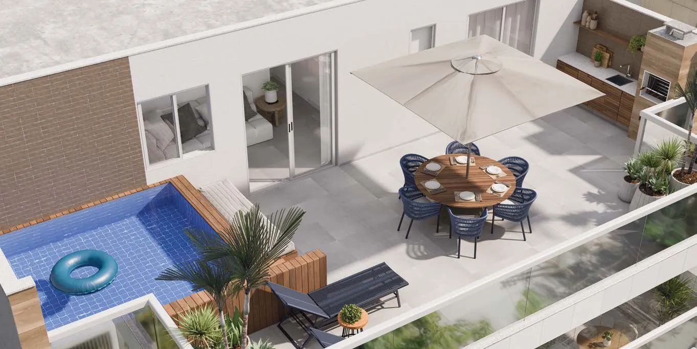 O terraço de uma cobertura duplex do Basílio Tijuca, com piscina, mesa e ombrelone