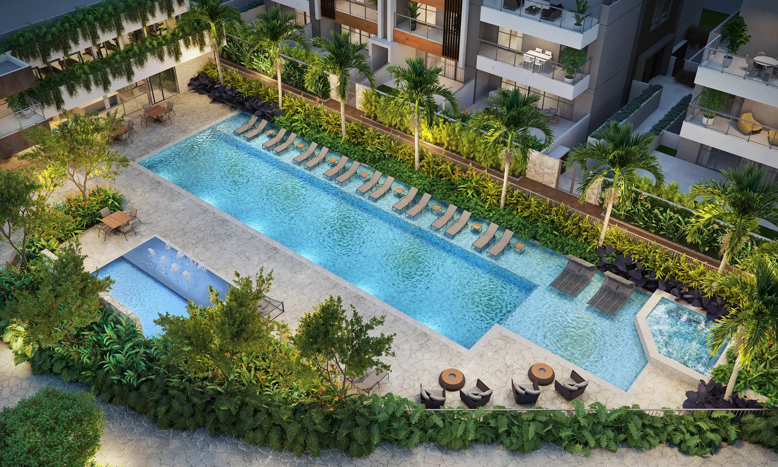 As piscinas do clube vistas do alto, com deck, espreguiçadeiras e jardins