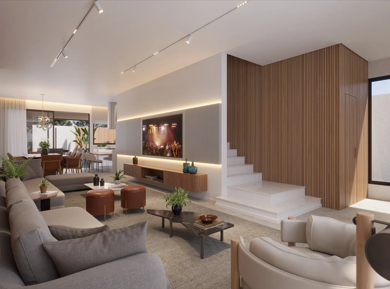 Sala com pé-direito duplo, escada de madeira e sofá