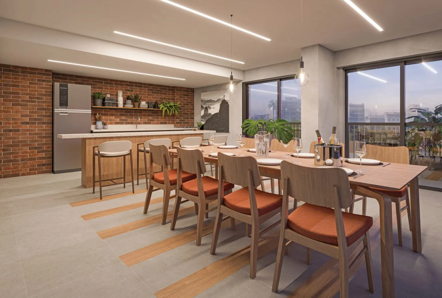 O espaço gourmet do Cores da Tijuca, com mesa comprida e cozinha