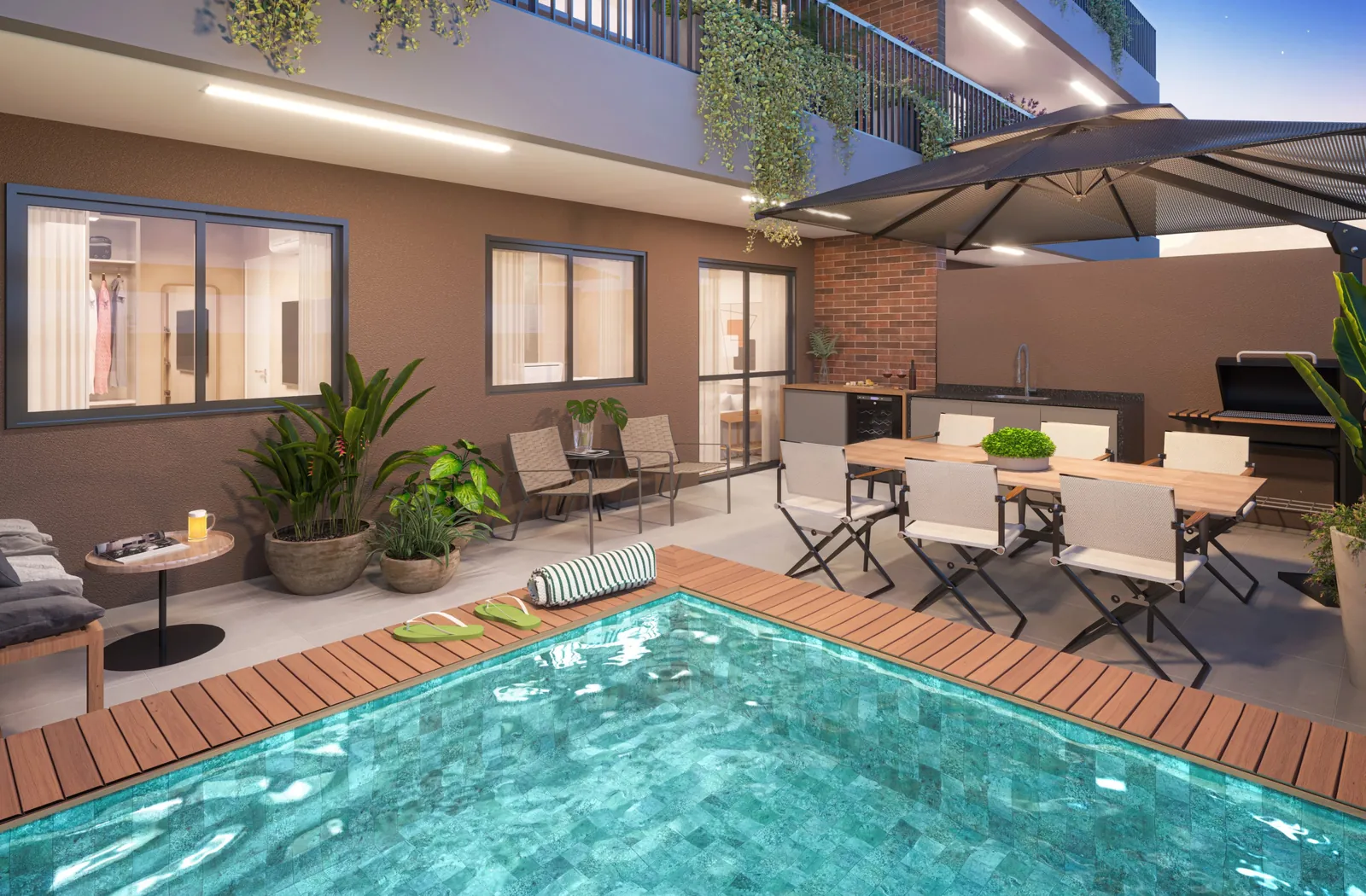 O terraço de um garden do Cores da Tijuca, com mesa e piscina