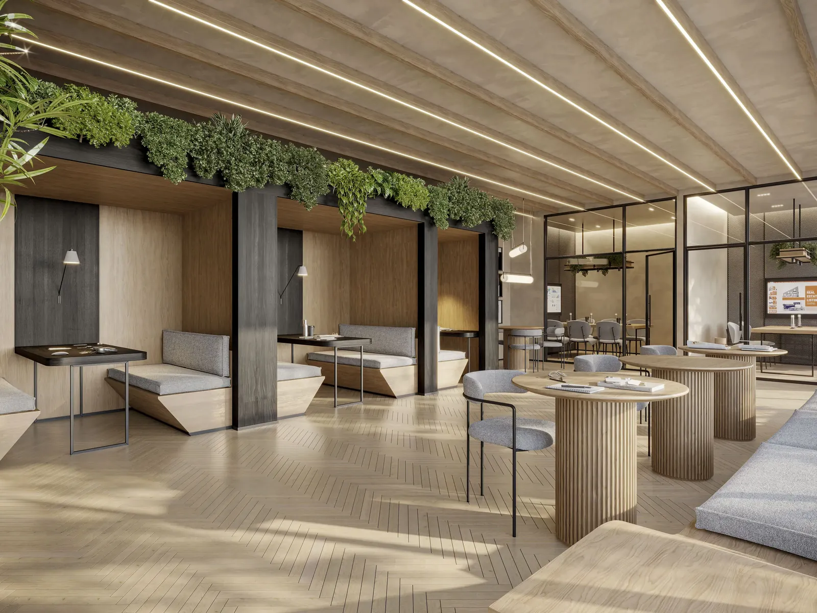 Coworking com mesas, poltronas e jardim vertical