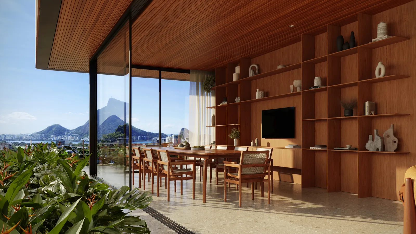 Mesa de jantar comprida de madeira com estante e vista para a Lagoa