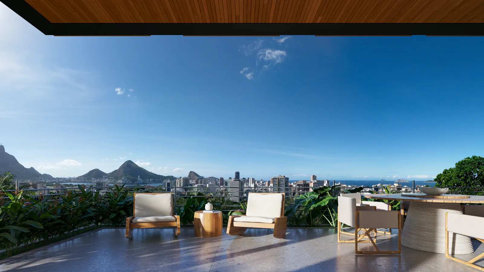 Terraço com poltronas e a vista da Lagoa e das montanhas