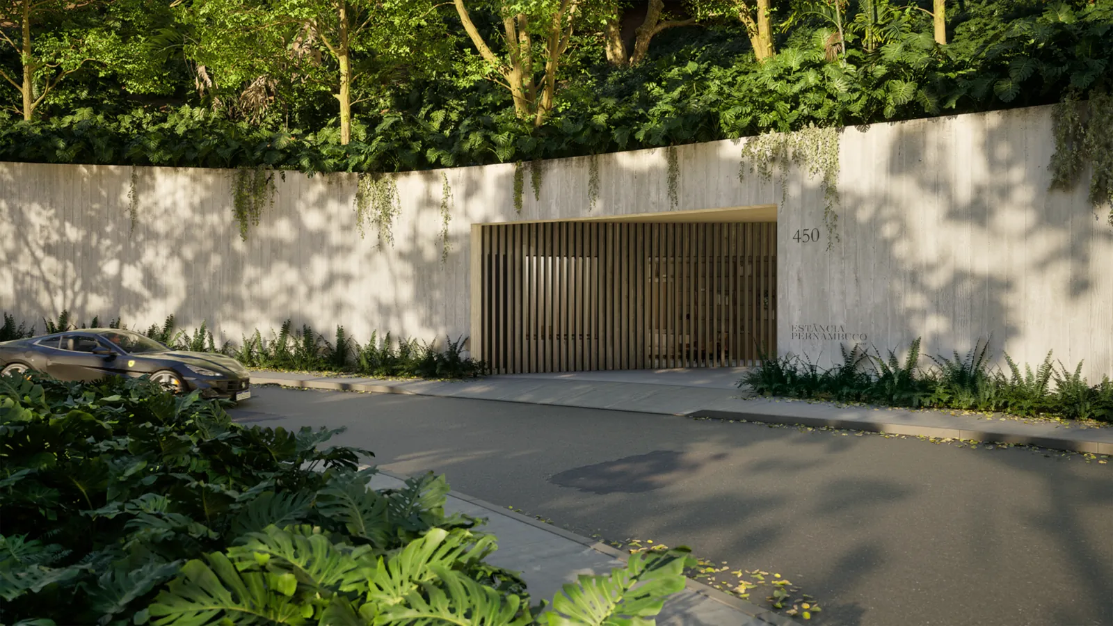 A entrada do condomínio, com muro de pedra, portão de madeira e jardim