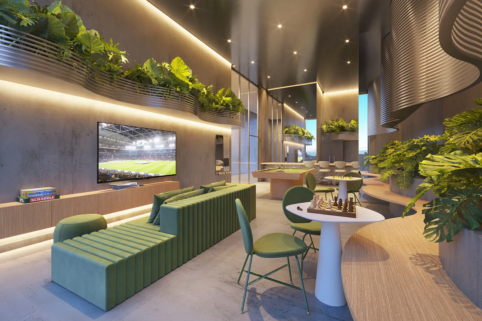 O lounge de jogos do First, com sofá verde e mesas