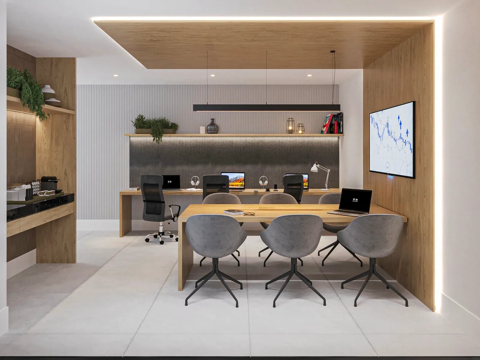 Coworking com mesa de reunião, cadeiras cinza e bancada de trabalho