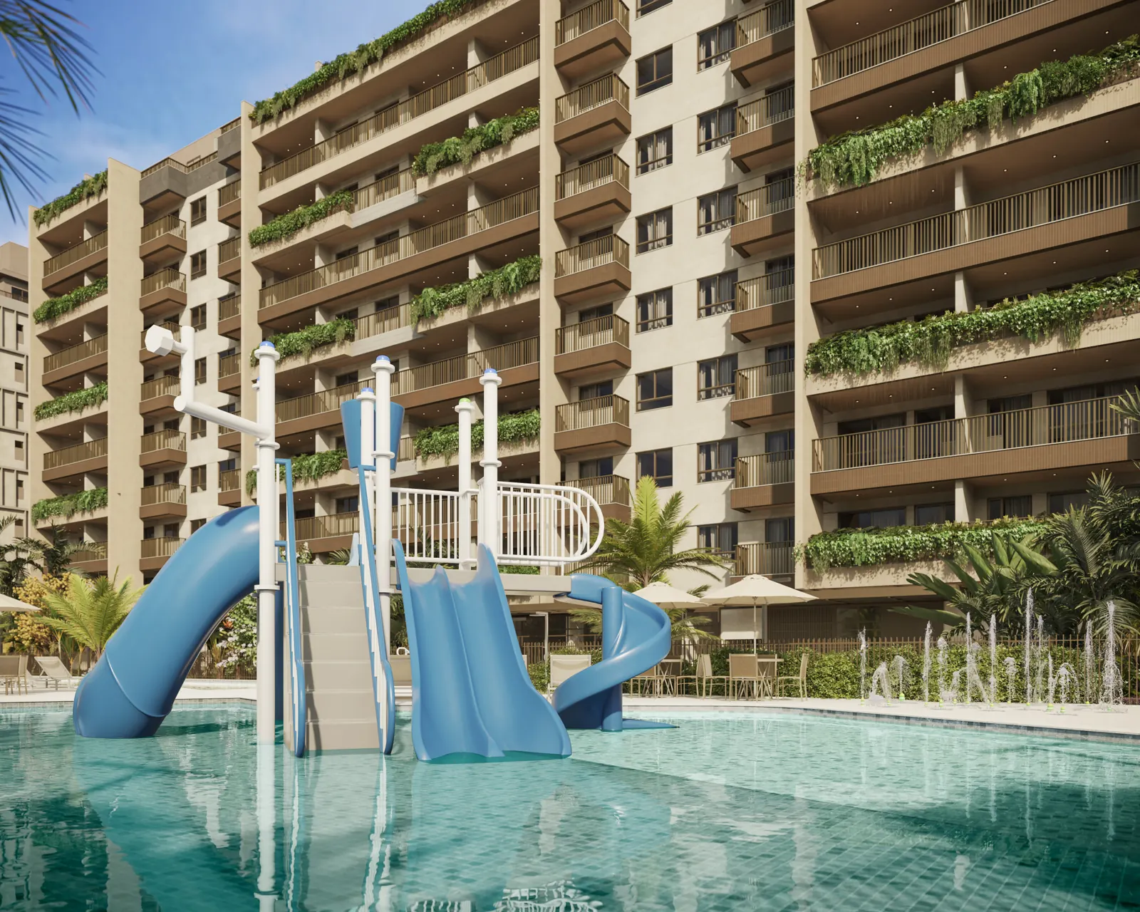 Piscina infantil com toboáguas e os blocos ao fundo