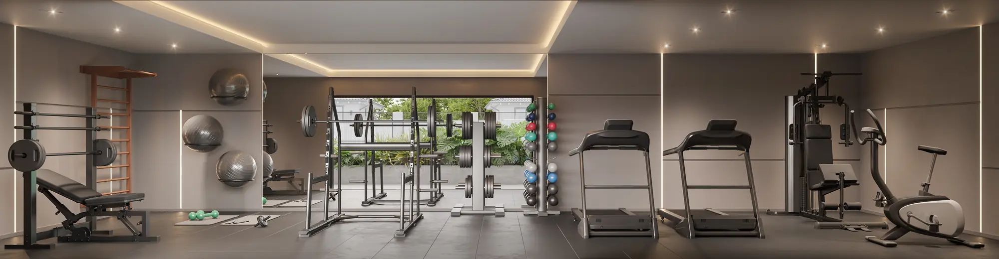 Espaço fitness com esteiras e aparelhos de musculação