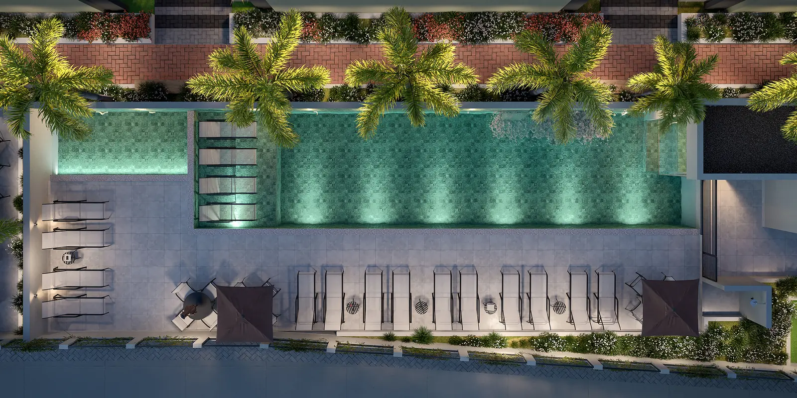 Piscina do condomínio iluminada à noite