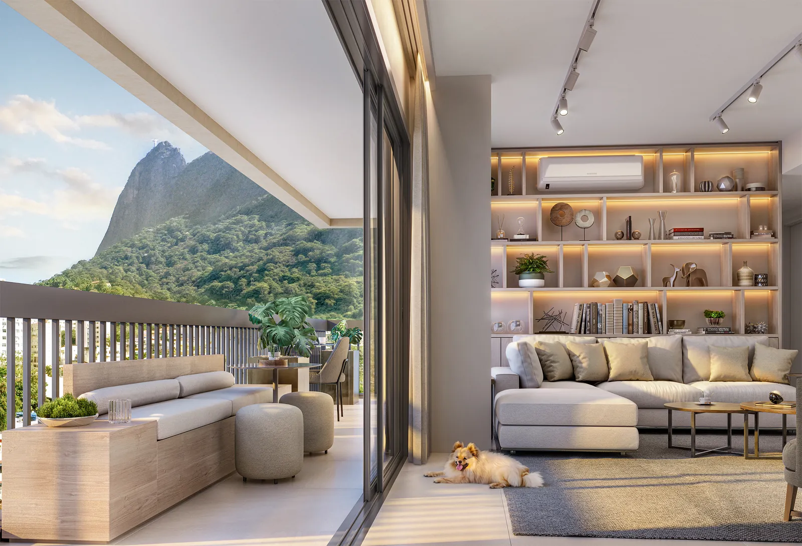 A sala de um apartamento do H.U.M aberta para a varanda, com o Corcovado ao fundo