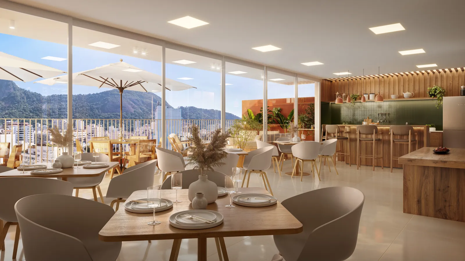Espaço gourmet com mesas, bancada e vista do terraço