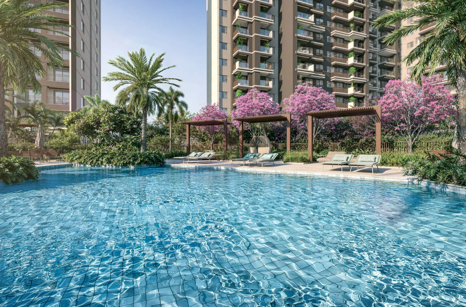A piscina do In The Park com as torres ao fundo e árvores floridas
