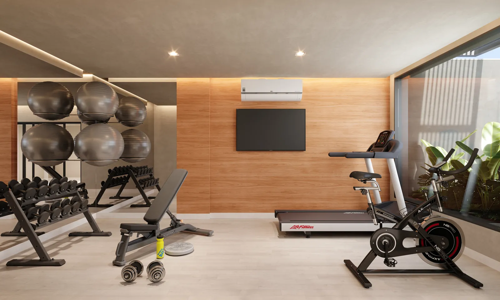 Academia com bicicleta, bancos e bolas de pilates