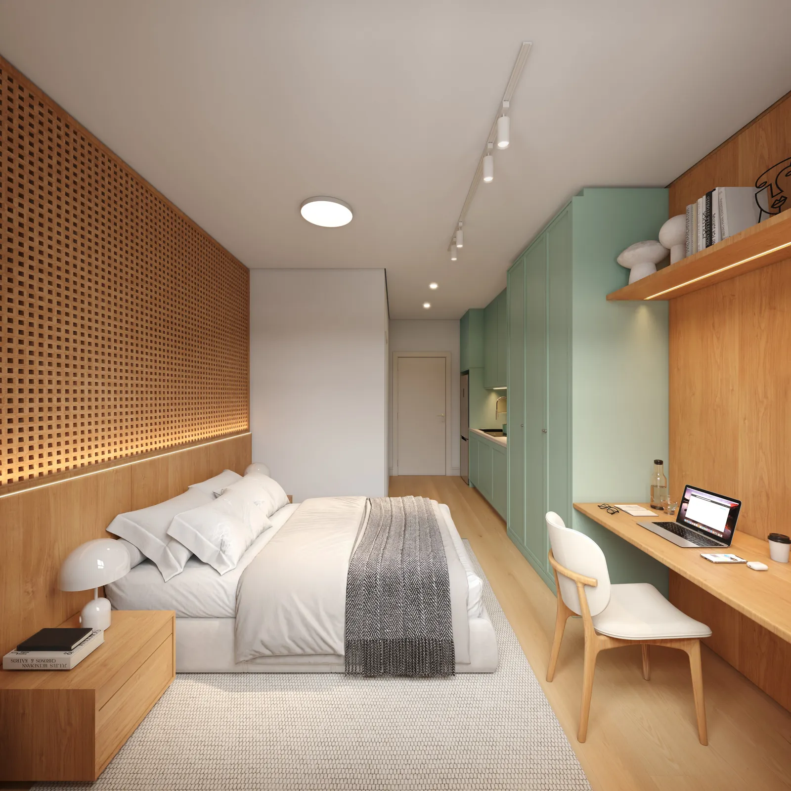 Studio claro com cama, bancada de trabalho e armário verde