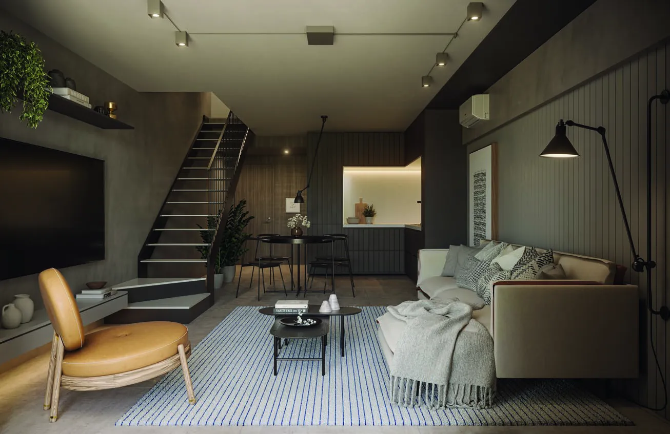 A sala de uma cobertura do Oui Ipanema, com escada para o andar de cima