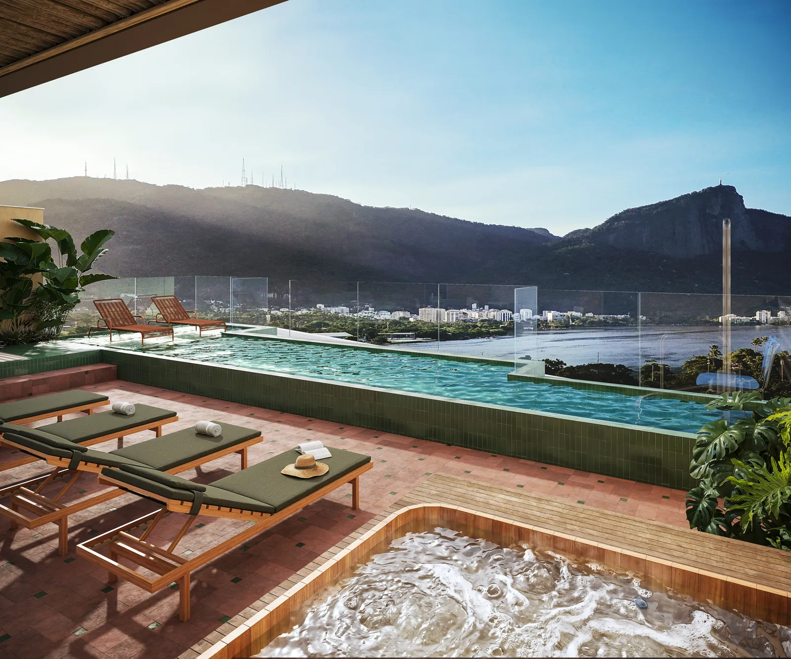 Rooftop com piscina, espreguiçadeiras e a Lagoa com o Cristo ao fundo