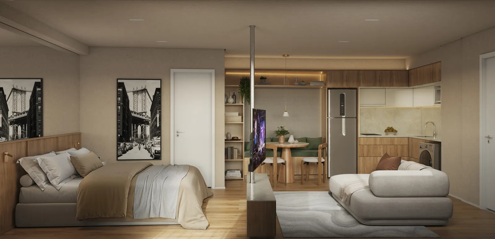Studio com cama de casal, sofá e cozinha ao fundo