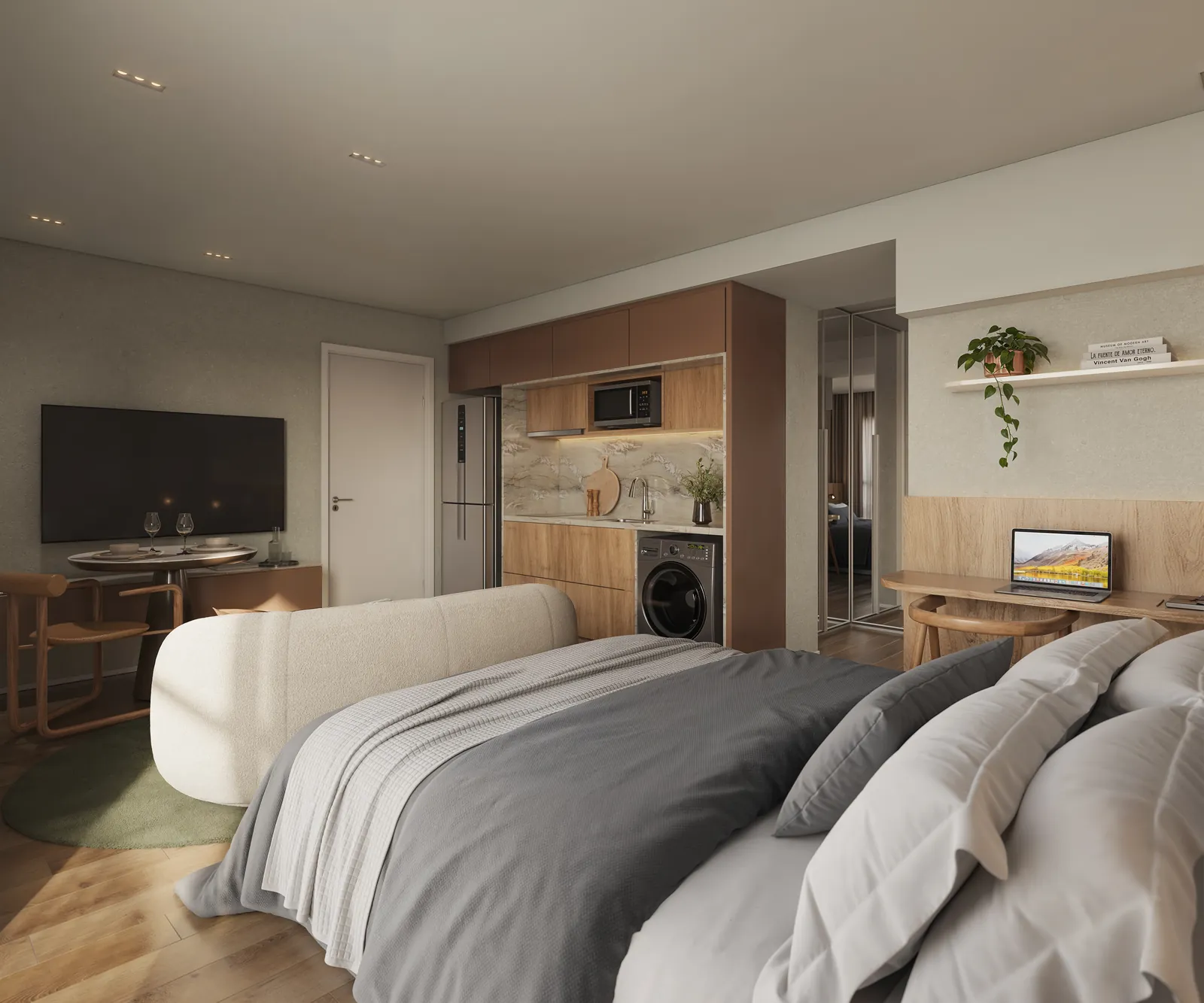 Sofá curvo, cama e cozinha integrados no studio