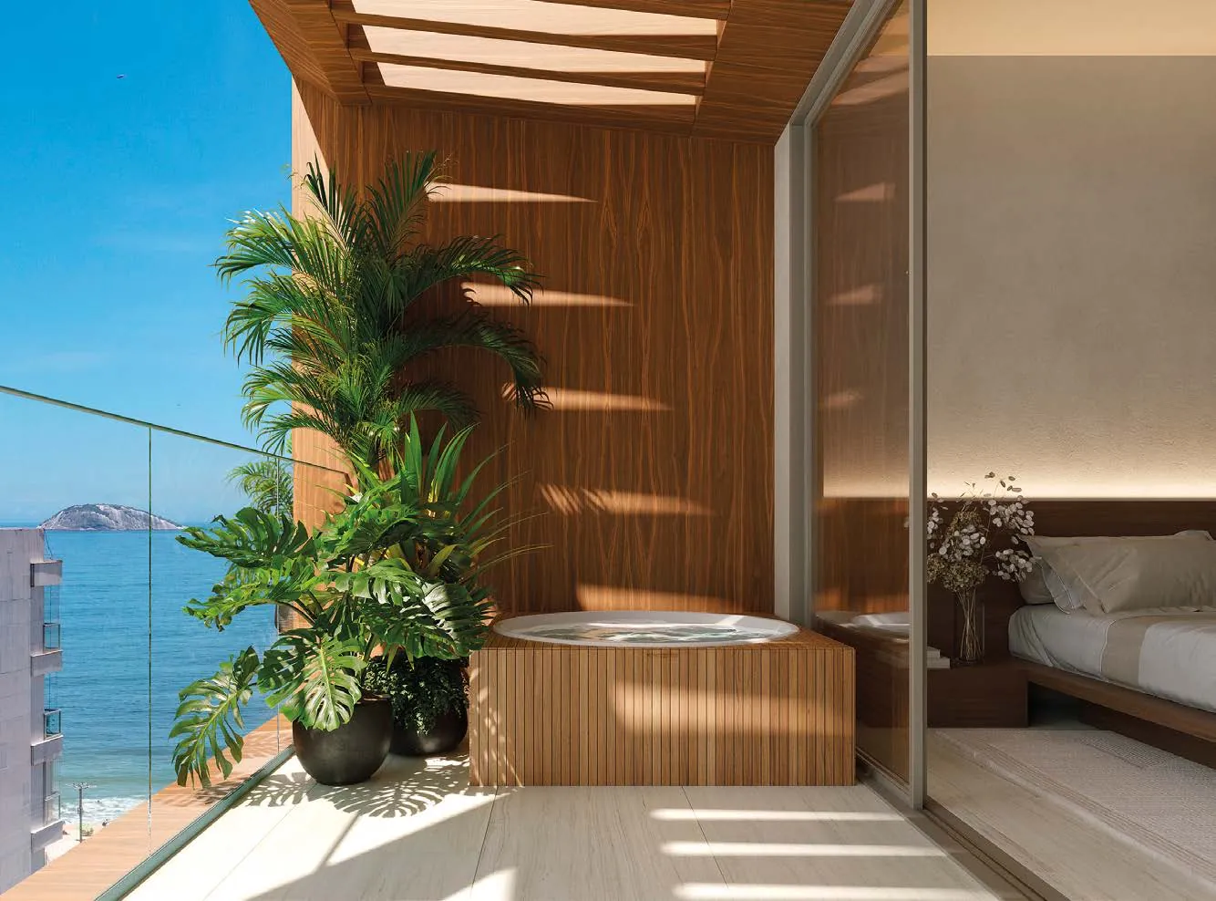 O terraço de uma cobertura do Riô com plantas e o mar ao fundo