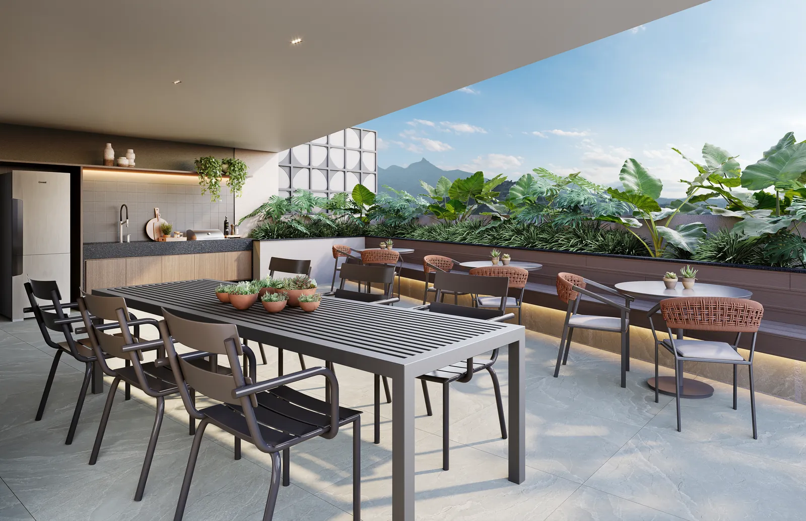 Área gourmet coberta com mesa comprida e bancada