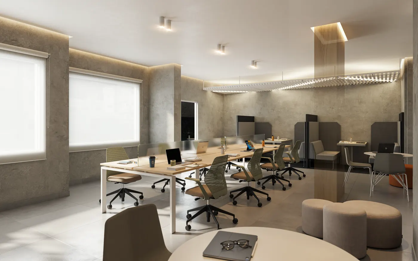 Coworking com bancadas, cadeiras de escritório e mesa redonda