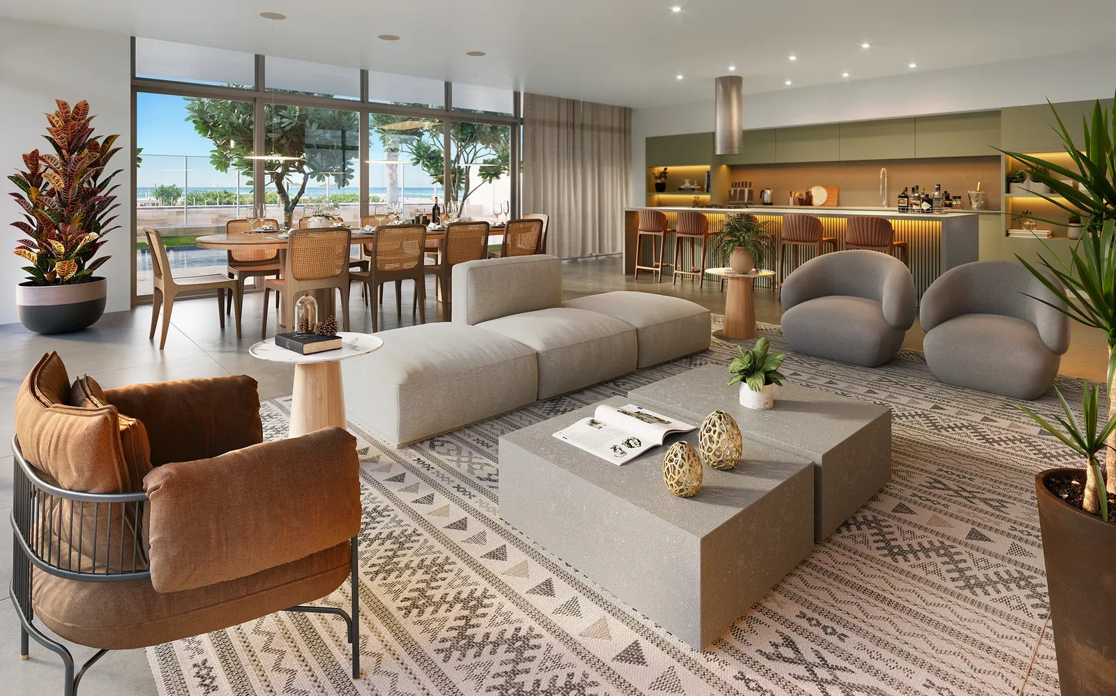 Espaço gourmet com sofás, mesas e cozinha aberta